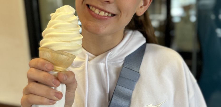 Teen girl eating a free birthday ice cream from Chick-fil-A